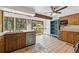 Charming kitchen with tile flooring, wooden cabinets, and a bright window overlooking the backyard at 1037 Wagonwheel Gap Rd, Boulder, CO 80302