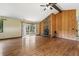Spacious living room with stone fireplace and hardwood floors, filled with natural light at 1037 Wagonwheel Gap Rd, Boulder, CO 80302