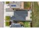 Aerial view of the house with a large driveway and backyard with a patio at 27639 E 7Th Ln, Aurora, CO 80018