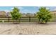 Paver patio with young trees looking over green space and neighboring houses at 27639 E 7Th Ln, Aurora, CO 80018