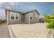 Backyard features a patio with stone blocks, a well-manicured lawn and a house with brown siding at 27639 E 7Th Ln, Aurora, CO 80018