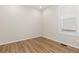 Bedroom featuring wood flooring, one window and neutral colored walls at 27639 E 7Th Ln, Aurora, CO 80018