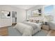 Bright main bedroom with large bed, modern art, and closet at 27639 E 7Th Ln, Aurora, CO 80018