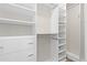 Organized walk-in closet with built-in shelving, drawers, and hanging rods, maximizing storage space at 27639 E 7Th Ln, Aurora, CO 80018
