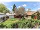 A relaxing backyard featuring lush greenery and a charming outbuilding at 1275 Niagara St, Denver, CO 80220
