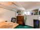 Finished basement area with a workspace, storage, and natural light at 1275 Niagara St, Denver, CO 80220