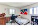 Inviting bedroom with a comfortable bed, natural light, and cozy atmosphere at 1275 Niagara St, Denver, CO 80220