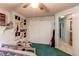This bedroom features light blue walls, a ceiling fan, and closet with sliding doors at 1275 Niagara St, Denver, CO 80220