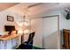 Cozy bedroom with desk and chair, perfect for a home office, and a closet with sliding doors at 1275 Niagara St, Denver, CO 80220