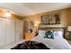 Relaxing bedroom boasts a plush bed, soft lighting, and tasteful decor, creating a cozy retreat at 1275 Niagara St, Denver, CO 80220