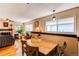 Dining area with hardwood floors next to living room at 1275 Niagara St, Denver, CO 80220