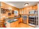 Charming kitchen featuring wooden cabinets and countertops at 1275 Niagara St, Denver, CO 80220