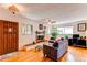 Comfortable living room with hardwood floors, fireplace, and ample natural light at 1275 Niagara St, Denver, CO 80220