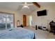 Bedroom with vaulted ceilings, neutral carpet, and sliding glass door at 4231 S Fairplay Cir # A, Aurora, CO 80014