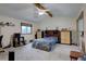 Bedroom with vaulted ceilings, neutral carpet, and large windows at 4231 S Fairplay Cir # A, Aurora, CO 80014