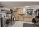Laundry room with stainless steel washer and dryer, plus storage at 4231 S Fairplay Cir # A, Aurora, CO 80014
