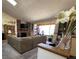Bright and airy living room with a fireplace, large windows, and comfortable seating at 4231 S Fairplay Cir # A, Aurora, CO 80014