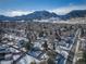 Scenic aerial shot of a residential neighborhood with mountains in the background at 1120 Hartford Dr, Boulder, CO 80305