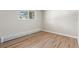 A clean and bright bedroom featuring wood floors and plenty of natural light at 1120 Hartford Dr, Boulder, CO 80305