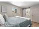Comfortable bedroom with a private bathroom featuring a unique sliding door at 1120 Hartford Dr, Boulder, CO 80305
