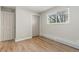 Bedroom with hardwood floors, a window, closet, and interior door at 1120 Hartford Dr, Boulder, CO 80305