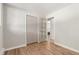 Bedroom with hardwood floors, closet, and bright natural light at 1120 Hartford Dr, Boulder, CO 80305