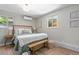 Bright bedroom with a large bed, natural light, and a stylish bench at 1120 Hartford Dr, Boulder, CO 80305