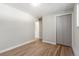 This bedroom is equipped with hardwood floors, a large closet and neutral paint at 1120 Hartford Dr, Boulder, CO 80305