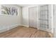 Bedroom with hardwood floors, closet, and bright natural light at 1120 Hartford Dr, Boulder, CO 80305