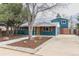 Bright home featuring blue siding, orange shutters and garage door, concrete driveway, and rock landscaping at 1120 Hartford Dr, Boulder, CO 80305