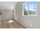 Living room with vaulted ceiling and windows with treed mountain views at 1120 Hartford Dr, Boulder, CO 80305