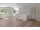 An open-plan living room is bright and airy with light wood floors and vaulted ceilings at 1120 Hartford Dr, Boulder, CO 80305