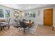 Cozy living room featuring hardwood floors, a comfortable seating area, and large windows for natural light at 1120 Hartford Dr, Boulder, CO 80305