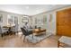 Comfortable living room with hardwood floors, a cozy rug, and a wooden door with a window view at 1120 Hartford Dr, Boulder, CO 80305