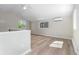 Bright living room featuring wood floors, high ceilings, and large windows at 1120 Hartford Dr, Boulder, CO 80305