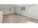 Living room with wood-look floors, vaulted ceilings, and lots of natural light at 1120 Hartford Dr, Boulder, CO 80305