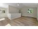 Bright living room with vaulted ceiling, neutral paint, and wood-look floors at 1120 Hartford Dr, Boulder, CO 80305