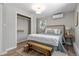 A well-lit main bedroom features a comfy bed and a walk-in closet for organized storage at 1120 Hartford Dr, Boulder, CO 80305