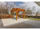 Relaxing backyard patio with a wooden pergola, outdoor seating, and a well-maintained lawn, perfect for entertaining at 1120 Hartford Dr, Boulder, CO 80305