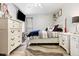 Cozy bedroom with a comfortable bed, ample storage, and stylish decor at 3663 S Sheridan Blvd # O15, Denver, CO 80235