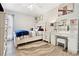 Bright bedroom featuring a stylish bed, white furniture, and modern decor at 3663 S Sheridan Blvd # O15, Denver, CO 80235