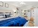 Cozy bedroom with stylish decor and a mirrored closet, offering a blend of comfort and functionality at 3663 S Sheridan Blvd # O15, Denver, CO 80235