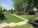 Expansive green space with mature trees and walking paths, perfect for outdoor activities and relaxation at 3663 S Sheridan Blvd # O15, Denver, CO 80235