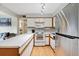 Well-lit kitchen with white cabinetry, stainless steel appliances, and ample counter space at 3663 S Sheridan Blvd # O15, Denver, CO 80235