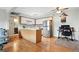 Open concept kitchen and living area with modern appliances and comfortable seating at 3663 S Sheridan Blvd # O15, Denver, CO 80235