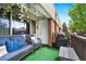Inviting patio featuring wicker furniture, a grill, and serene outdoor ambiance at 3663 S Sheridan Blvd # O15, Denver, CO 80235