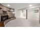 Finished basement featuring a unique brick fireplace and exposed support beam at 1661 E 86Th Pl, Denver, CO 80229