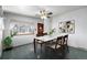 Bright dining area featuring modern marble-topped table and neutral color palette at 1661 E 86Th Pl, Denver, CO 80229