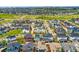 Expansive aerial view of a colorful neighborhood with greenery and modern homes at 9769 E 62Nd Dr, Denver, CO 80238