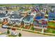 Aerial view of a neighborhood with many colorful modern homes and well-manicured landscaping at 9769 E 62Nd Dr, Denver, CO 80238